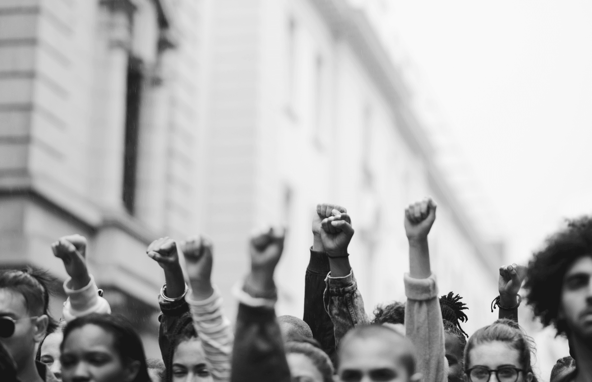 A number of fists are raised in the air.